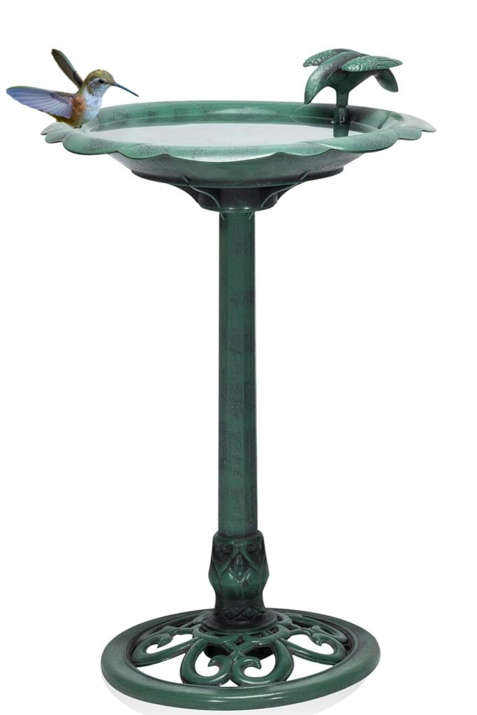 a bird bath with a bird on it